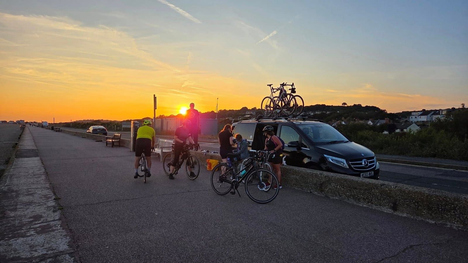 Cyclists at sunset, Folkestone